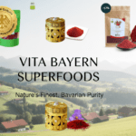 Vita Elixia Superfoods banner featuring premium saffron and organic powders over a scenic Bavarian mountain landscape.